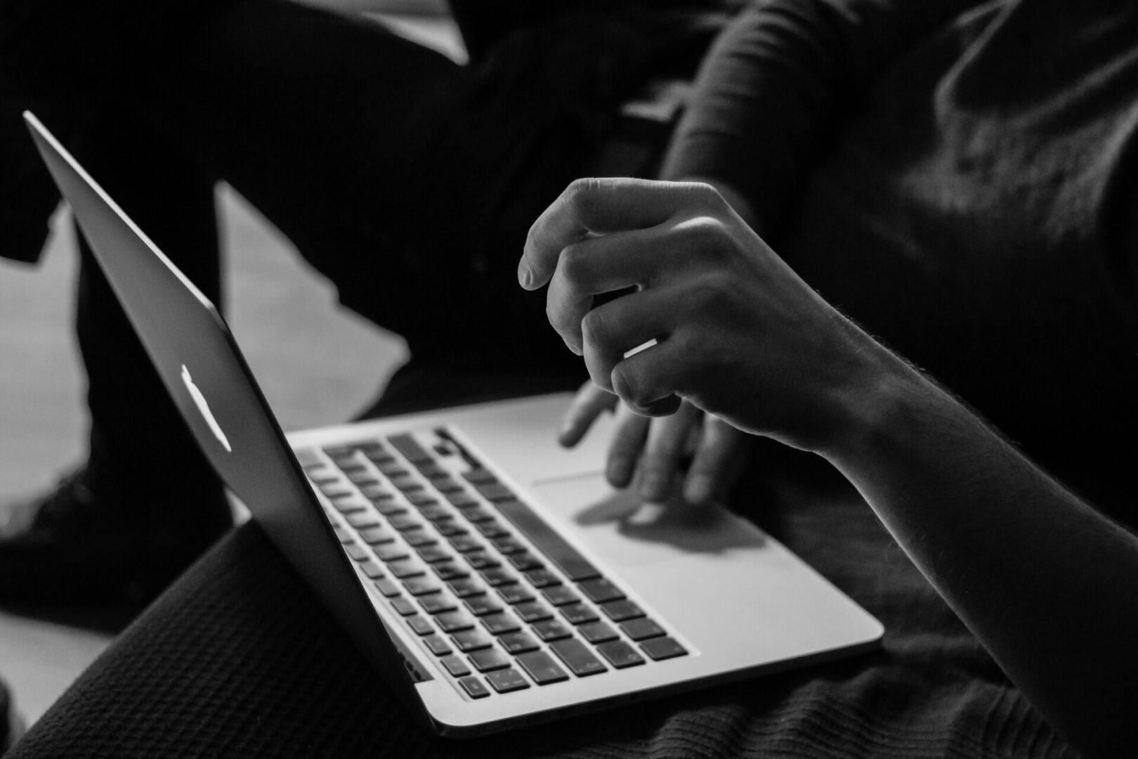 A person is typing on a laptop